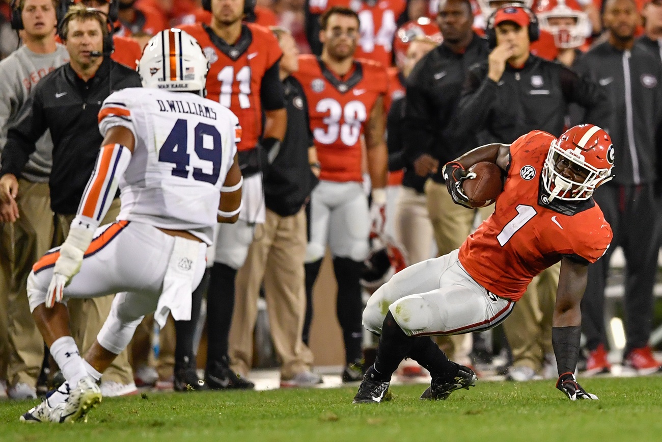 Nov 12, 2016; Athens, GA, USA; Georgia Bulldogs running back Sony Michel (1) is able to keep his balance in front of Auburn Tigers linebacker Darrell Williams (49) during the second half at Sanford Stadium. Georgia defeated Auburn 13-7. Mandatory Credit: Dale Zanine-USA TODAY Sports