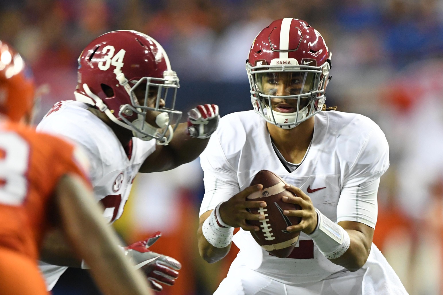 Dec 3, 2016; Atlanta, GA, USA; Alabama Crimson Tide quarterback Jalen Hurts (2) fakes a handoff to running back Damien Harris (34) during the second quarter of the SEC Championship college football game against the Florida Gators at Georgia Dome. Mandatory Credit: John David Mercer-USA TODAY Sports