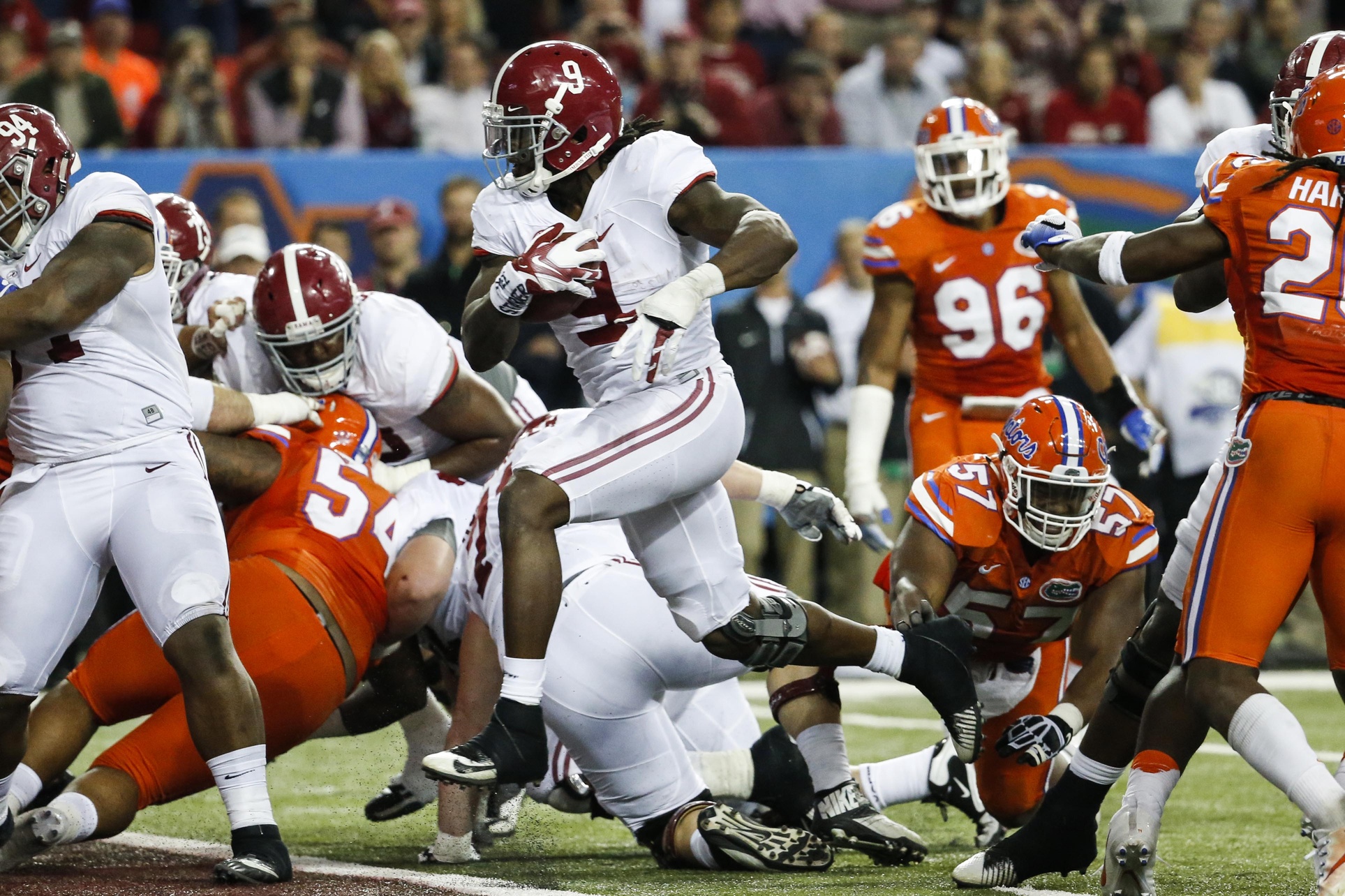 Dec 3, 2016; Atlanta, GA, USA; Alabama Crimson Tide running back Bo Scarbrough (9) scores a touchdown past Florida Gators defense during the fourth quarter of the SEC Championship college football game at Georgia Dome. Mandatory Credit: Jason Getz-USA TODAY Sports