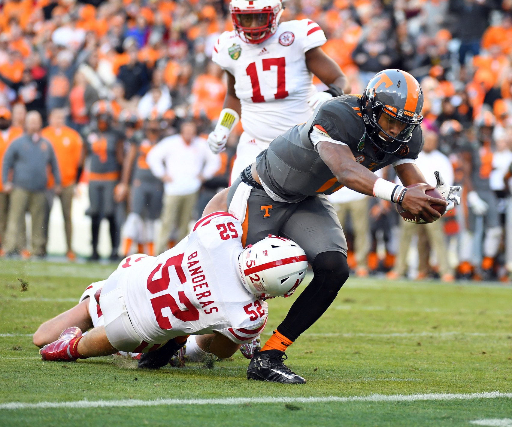 Dec 30, 2016; Nashville , TN, USA; Tennessee Volunteers quarterback Joshua Dobbs (11) reaches across the goal line for a touchdown during the first half against the Nebraska Cornhuskers at Nissan Stadium. Mandatory Credit: Christopher Hanewinckel-USA TODAY Sports