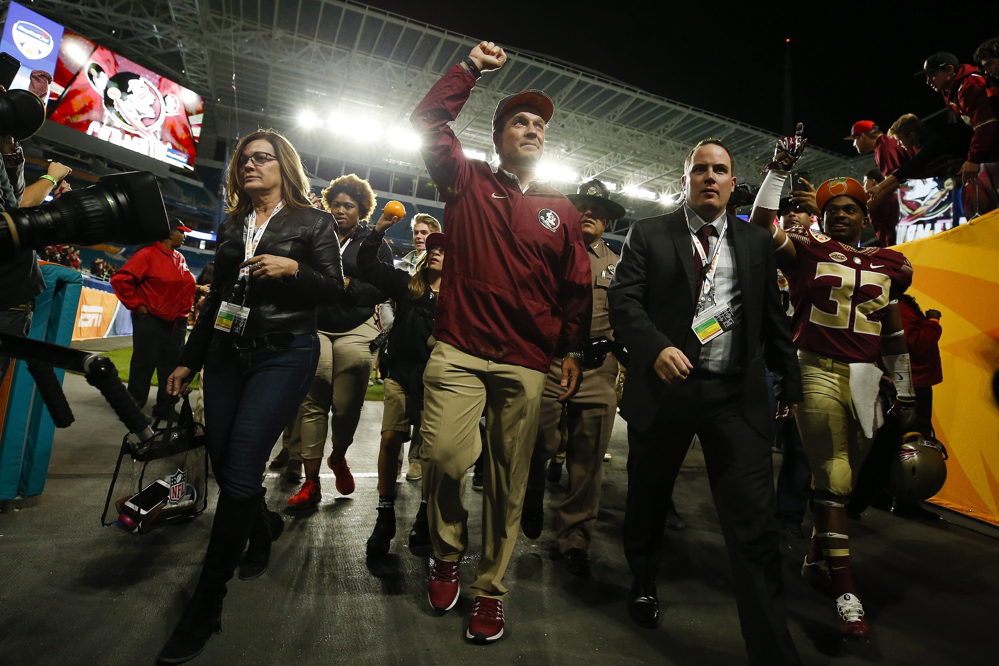Dec 30, 2016; Miami Gardens, FL, USA; Florida State Seminoles head coach Jimbo Fisher (center) walks off the field after a game against the Michigan Wolverines at Hard Rock Stadium. The Seminoles won 33-32. Mandatory Credit: Logan Bowles-USA TODAY Sports