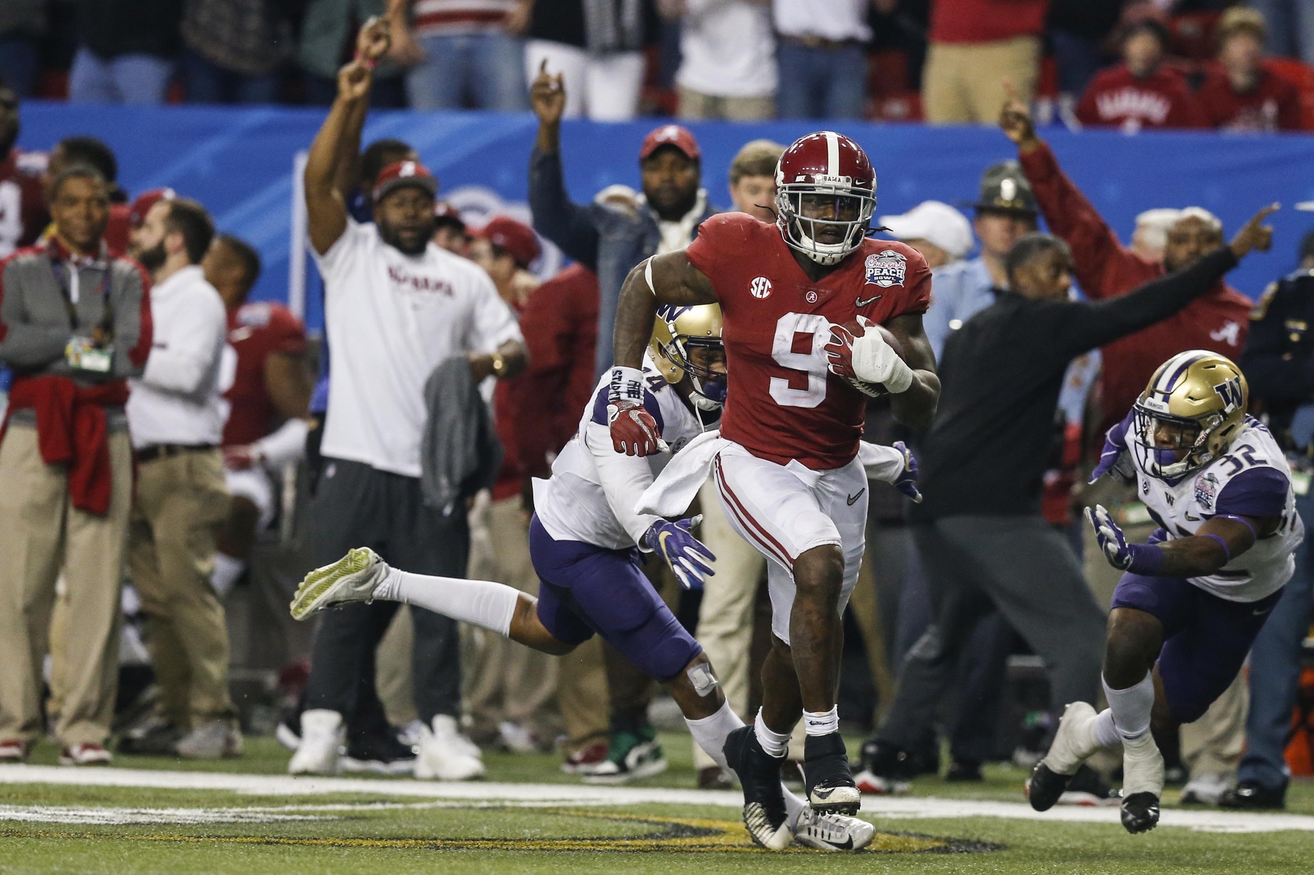 Dec 31, 2016; Atlanta, GA, USA; Alabama Crimson Tide running back Bo Scarbrough (9) runs the ball for a touchdown during the fourth quarter in the 2016 CFP Semifinal against the Washington Huskies at the Georgia Dome. Mandatory Credit: Jason Getz-USA TODAY Sports