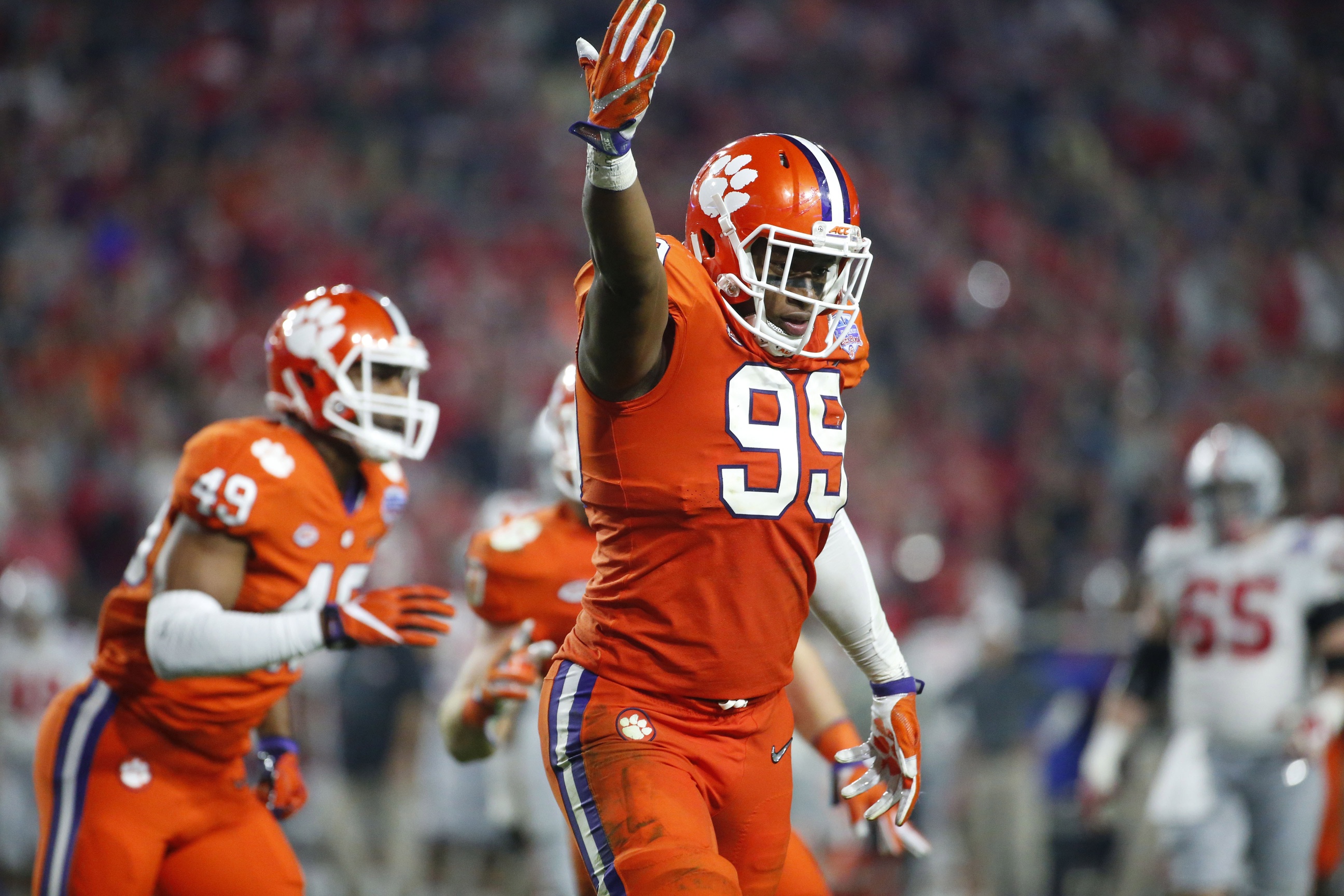 Dec 31, 2016; Phoenix, AZ, USA; Clemson Tigers defensive end Clelin Ferrell (99) celebrates after sacking Ohio State Buckeyes quarterback J.T. Barrett (16) during the fourth quarter during the 2016 CFP semifinal at University of Phoenix Stadium. Mandatory Credit: Cheryl Evans/The Arizona Republic via USA TODAY Sports