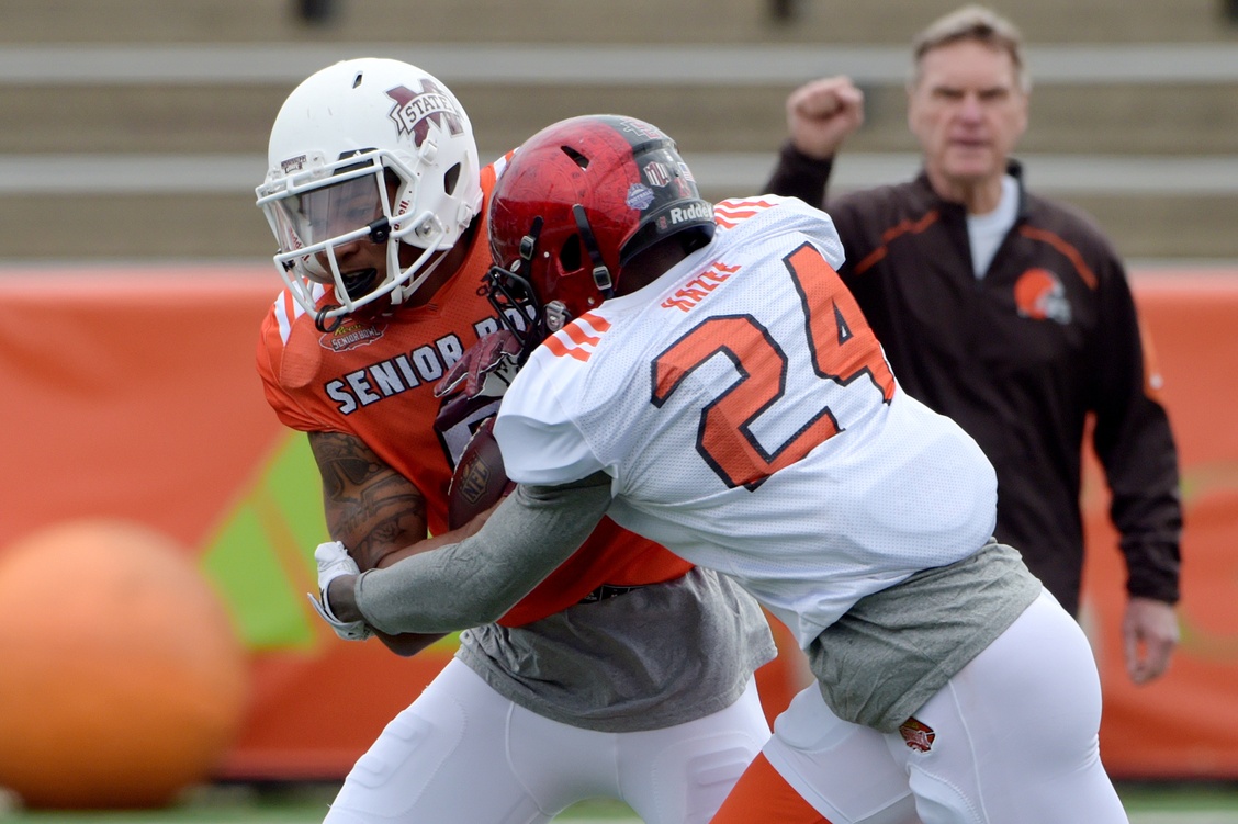 Jan 26, 2017; Mobile, AL, USA; South squad wide receiver Fred Ross of Mississippi State (8) is tackled by cornerback Damontae Kazee of San Diego State (24) during Senior Bowl practice at Ladd-Peebles Stadium. Mandatory Credit: Glenn Andrews-USA TODAY Sports