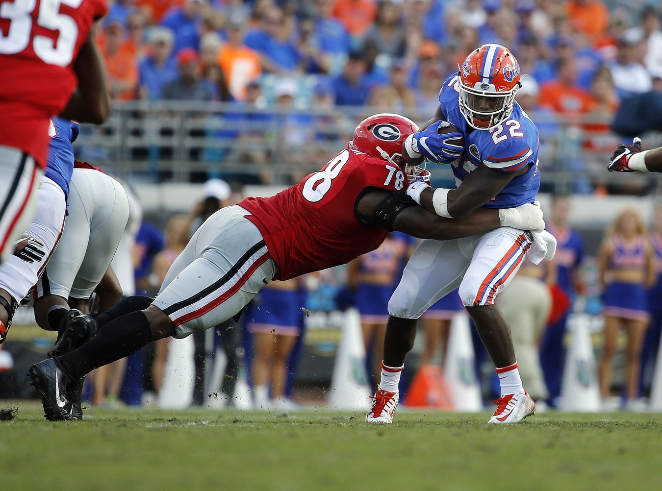 Oct 29, 2016; Jacksonville, FL, USA; Florida Gators running back Lamical Perine (22) runs with the ball as Georgia Bulldogs defensive tackle Trenton Thompson (78) defends during the first half at EverBank Field. Mandatory Credit: Kim Klement-USA TODAY Sports