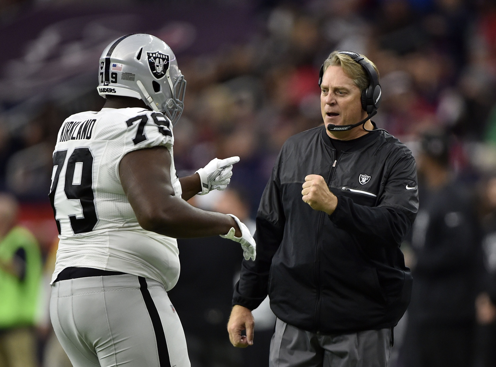 Jan 7, 2017; Houston, TX, USA; Oakland Raiders head coach Jack Del Rio celebrates with offensive guard Denver Kirkland (79) during the first half of the AFC Wild Card playoff football game against the Houston Texans at NRG Stadium. Mandatory Credit: Jerome Miron-USA TODAY Sports