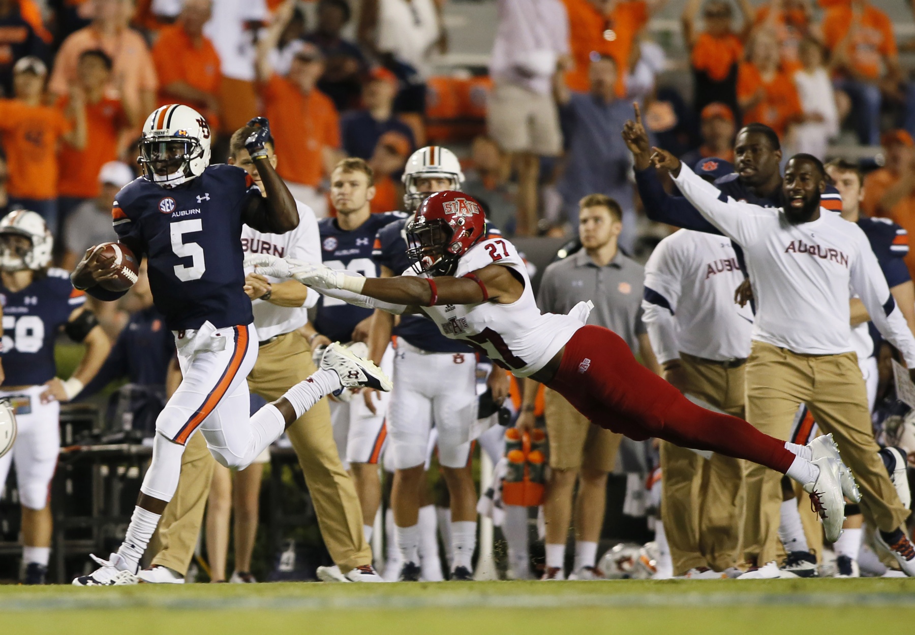 Sep 10, 2016; Auburn, AL, USA; Arkansas State Red Wolves safety Money Hunter (27) dives for Auburn Tigers quarterback John Franklin, III (5) during the fourth quarter at Jordan Hare Stadium. The Tigers beat the Red Wolves 51-14. Mandatory Credit: John Reed-USA TODAY Sports