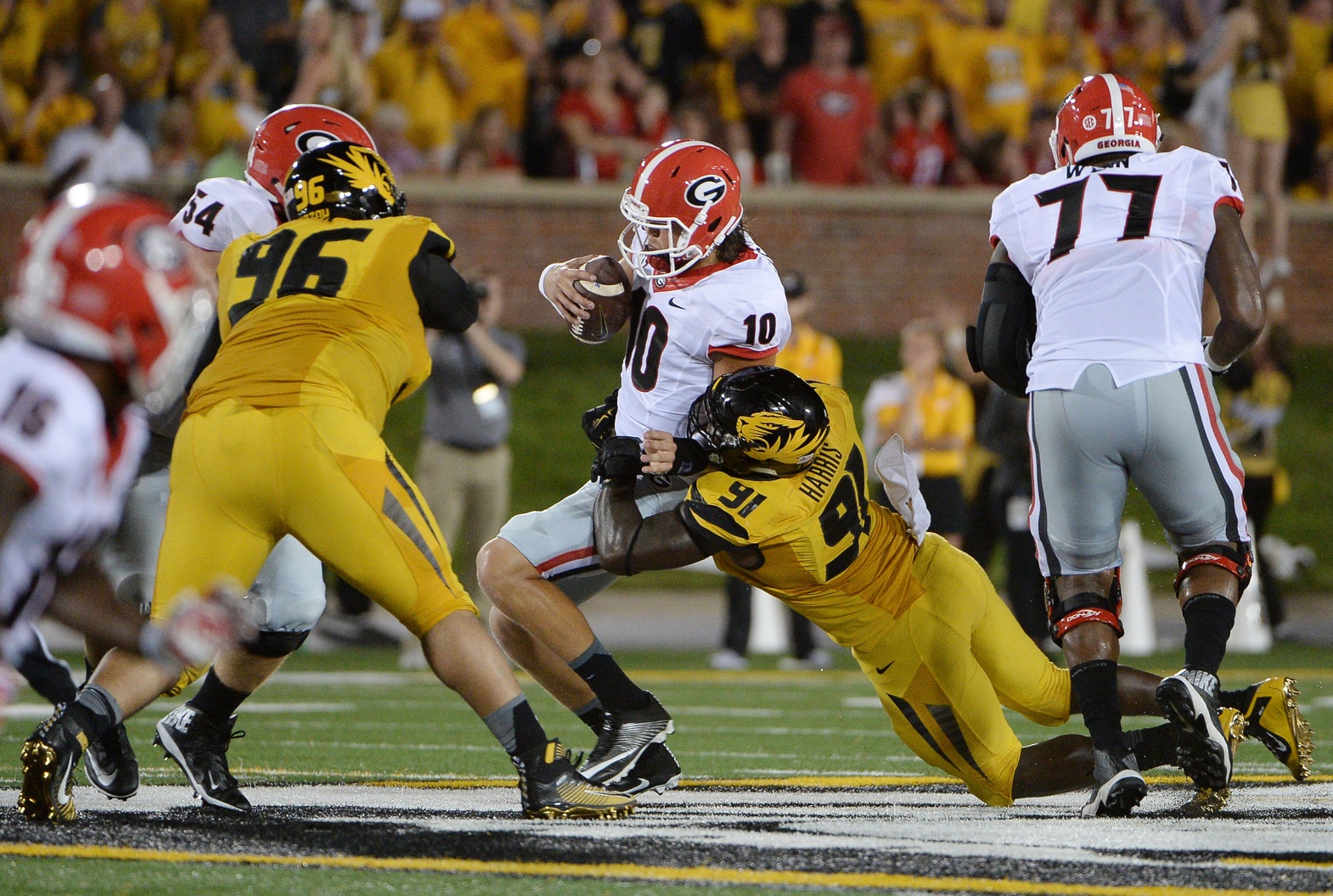 Sep 17, 2016; Columbia, MO, USA; Georgia Bulldogs quarterback Jacob Eason (10) is sacked by Missouri Tigers defensive end Charles Harris (91) in the first half at Faurot Field. Mandatory Credit: John Rieger-USA TODAY Sports