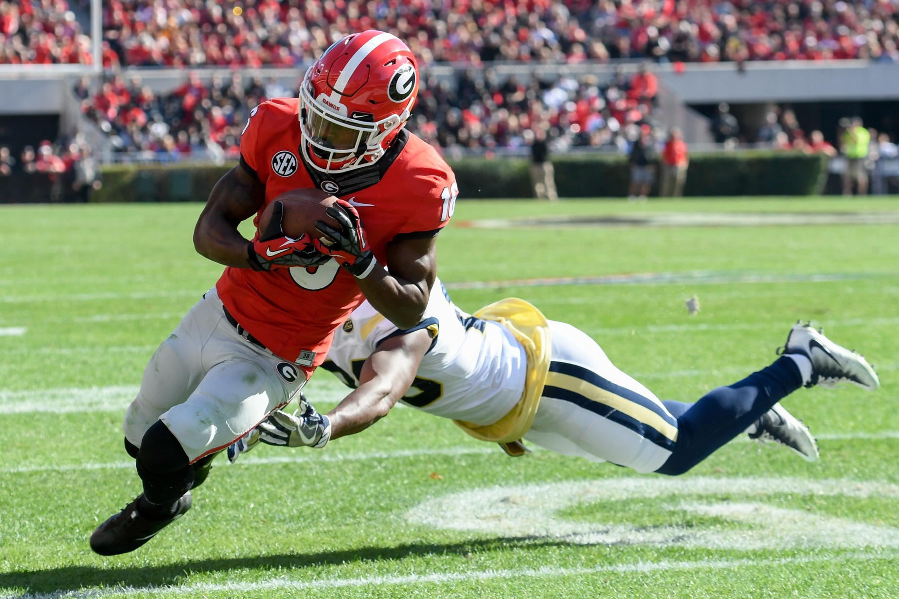 Nov 26, 2016; Athens, GA, USA; Georgia Bulldogs wide receiver Isaiah McKenzie (16) scores a touchdown against the Georgia Tech Yellow Jackets during the second quarter at Sanford Stadium. Mandatory Credit: Dale Zanine-USA TODAY Sports