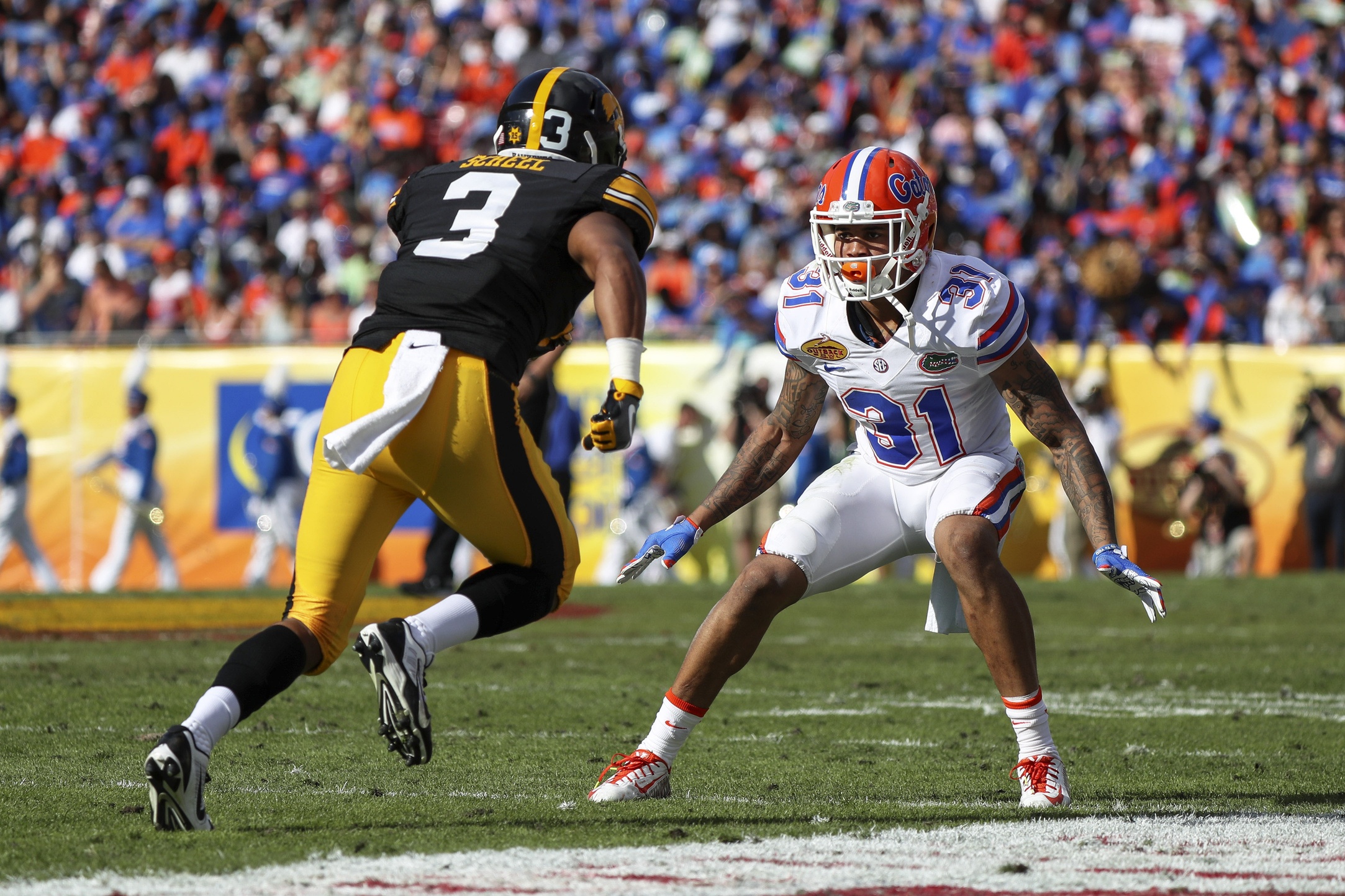 Jan 2, 2017; Tampa , FL, USA; Florida Gators defensive back Teez Tabor (31) defends Iowa Hawkeyes wide receiver Jay Scheel (3) in the second quarter at Raymond James Stadium. The Gators won 30-3. Mandatory Credit: Logan Bowles-USA TODAY Sports