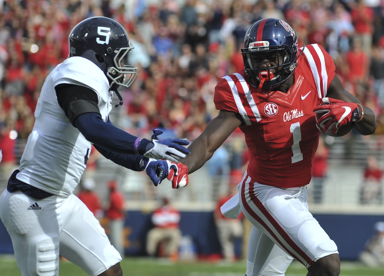 Nov 5, 2016; Oxford, MS, USA; Mississippi Rebels wide receiver A.J. Brown (1) carries the ball against Georgia Southern Eagles cornerback Darius Jones Jr. (5) during the first half at Vaught-Hemingway Stadium. Mandatory Credit: Justin Ford-USA TODAY Sports