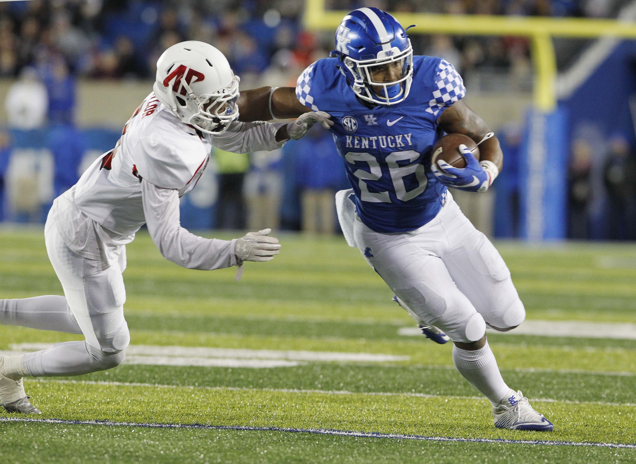 Nov 19, 2016; Lexington, KY, USA; Kentucky Wildcats running back Benny Snell (26) runs the ball against Austin Peay Governors defensive back Trent Taylor (9) in the first half at Commonwealth Stadium. Mandatory Credit: Mark Zerof-USA TODAY Sports