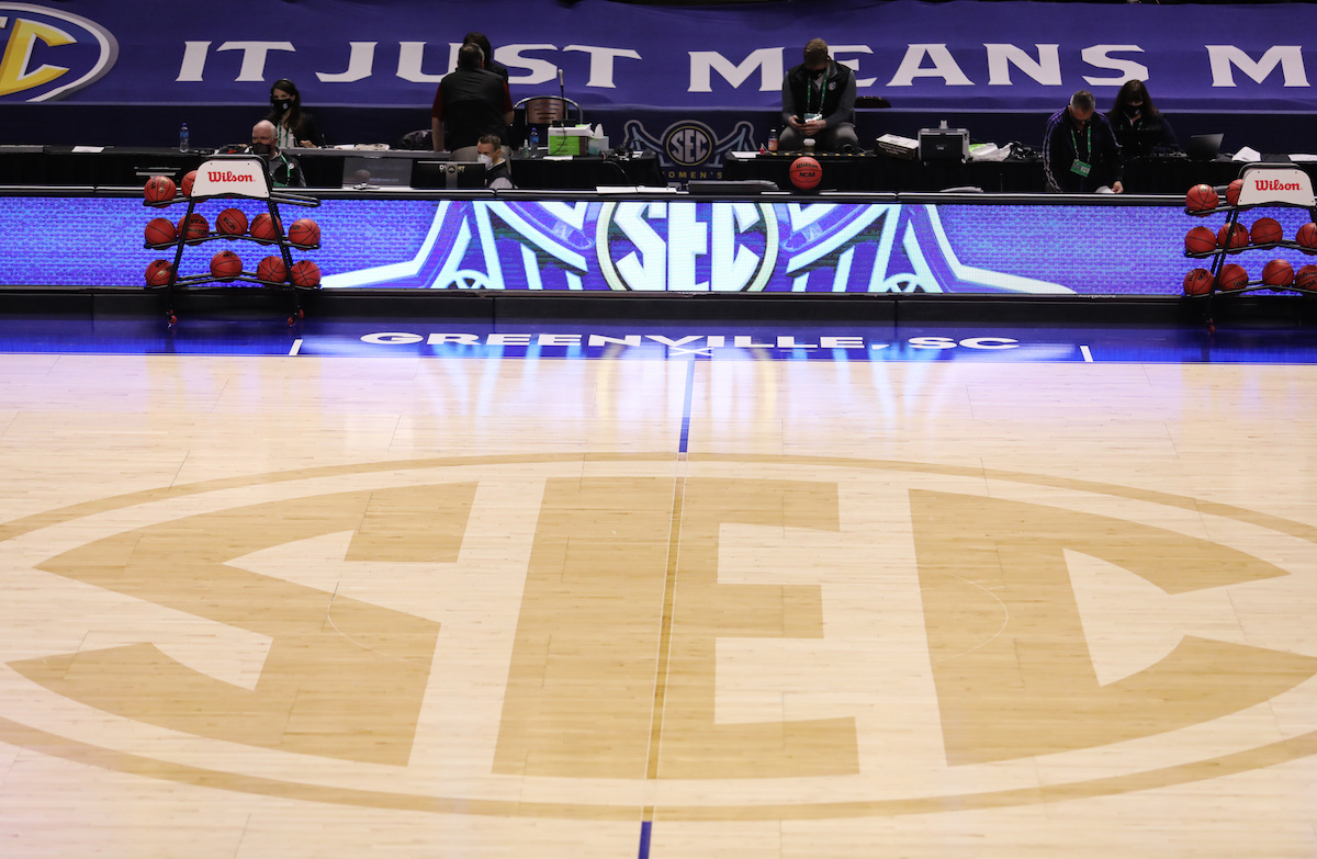 SEC logo on a basketball court.