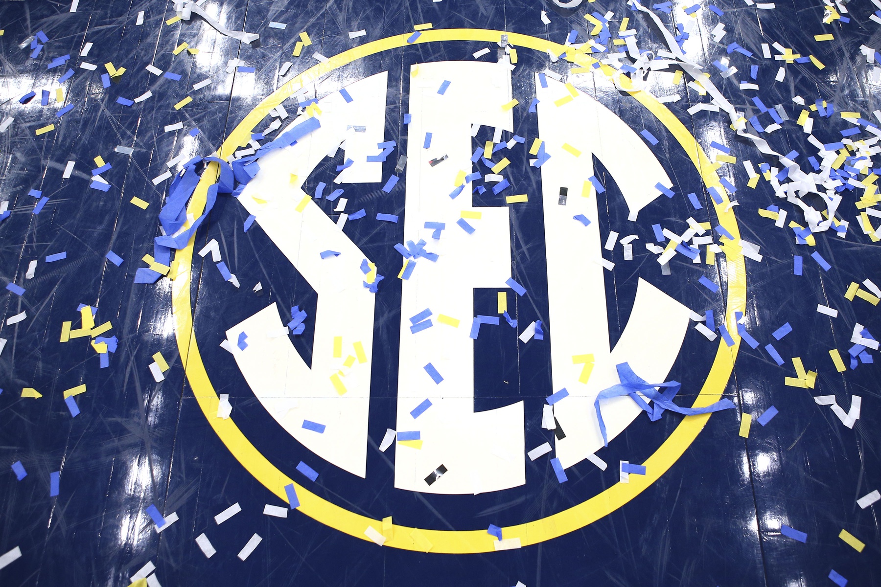 SEC logo on a basketball court.