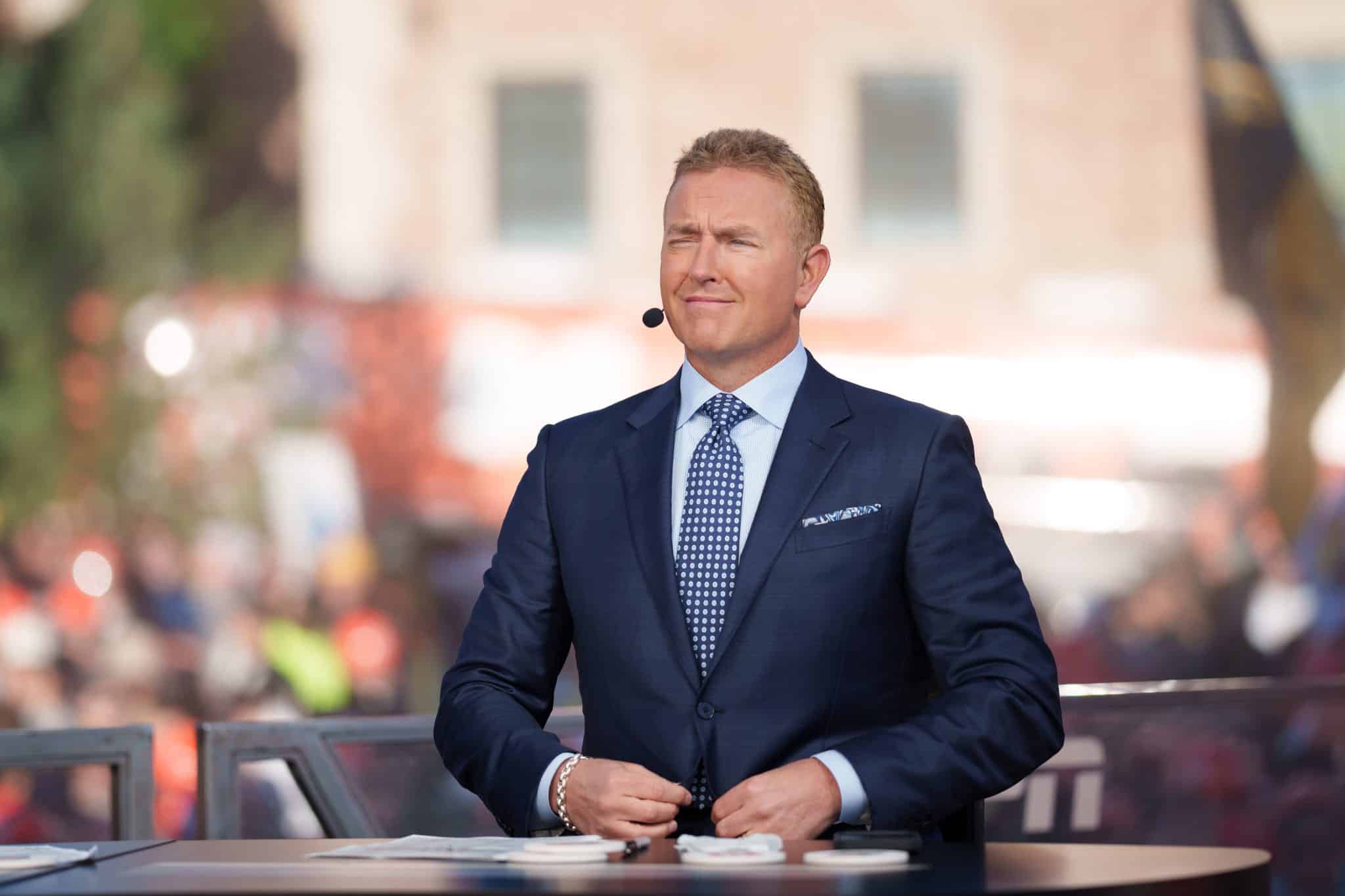 Kirk Herbstreit sits at the desk for College GameDay on ESPN.