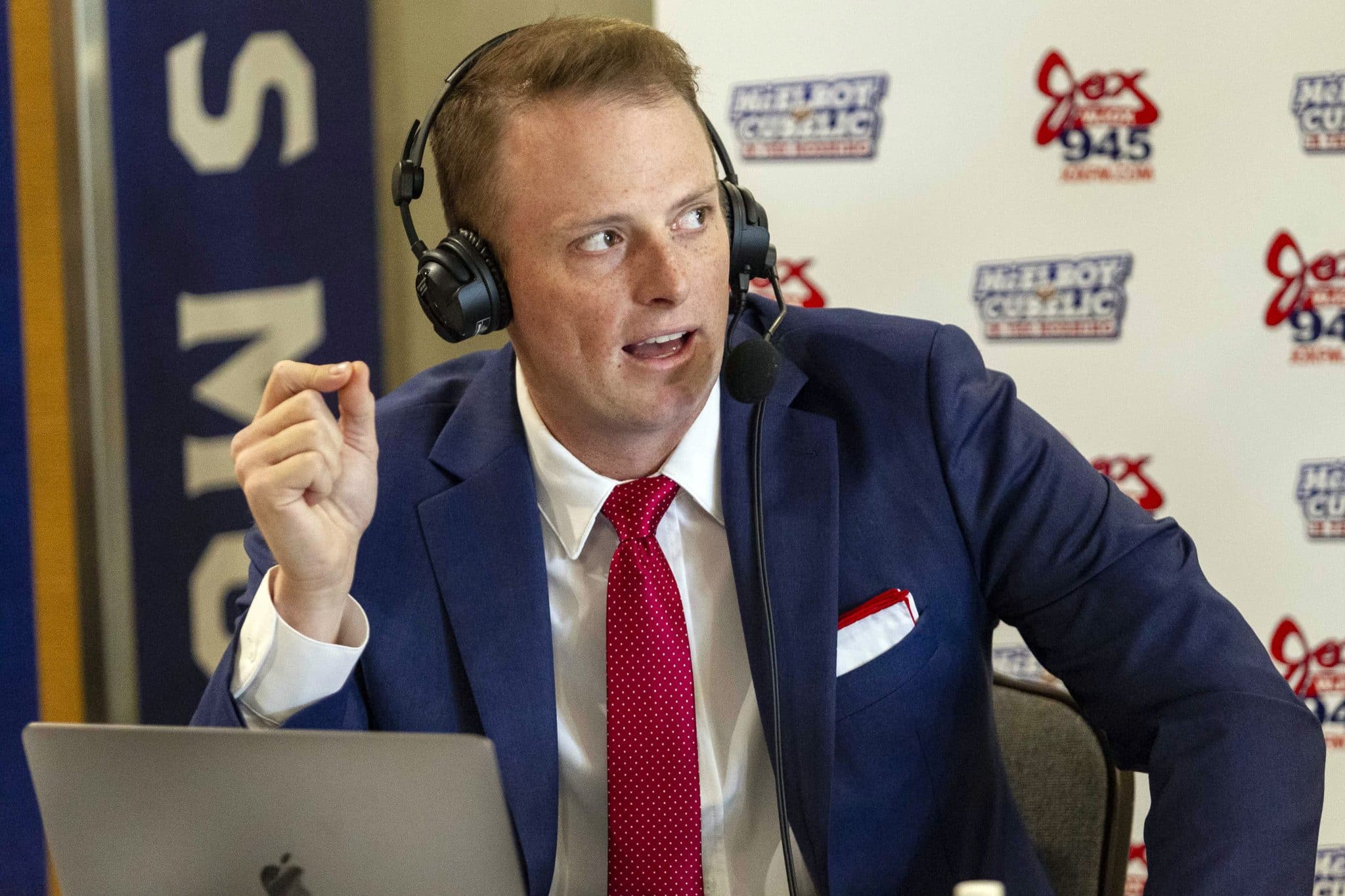 Greg McElroy talks during a radio show.