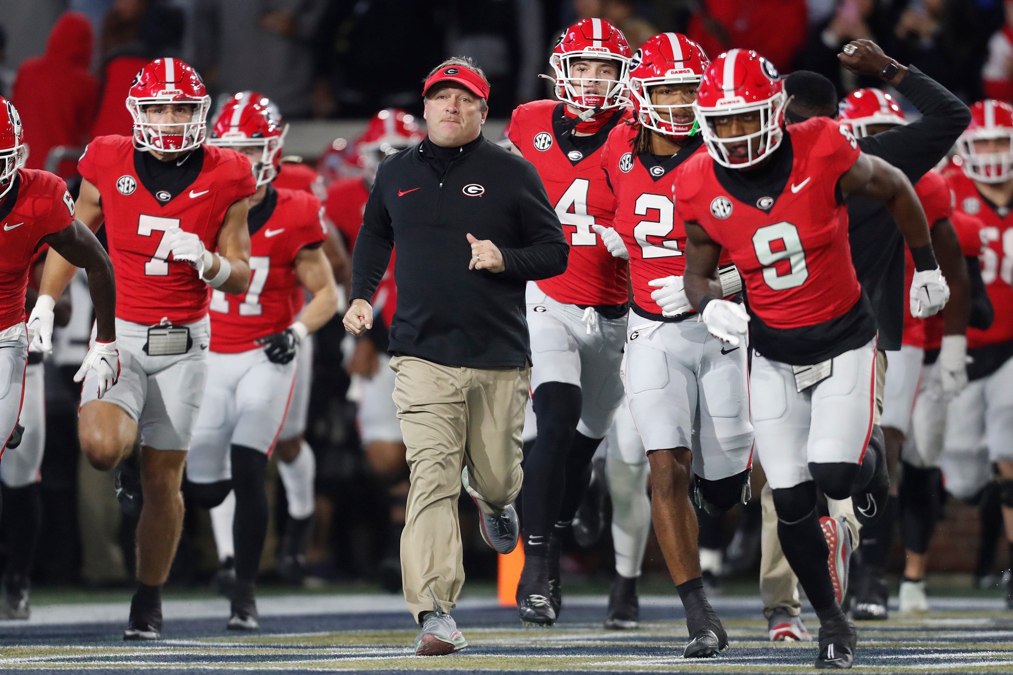 Kirby Smart leads the Georgia Bulldogs out onto the field ahead of the game against Georgia Tech in 2023.