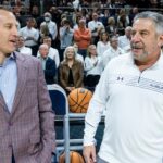 Nate Oats and Bruce Pearl talk before a game.