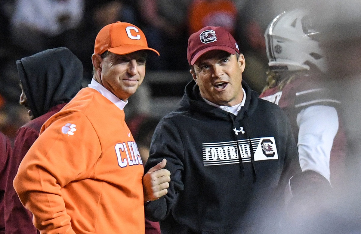 Clemson coach Dabo Swinney and South Carolina coach Shane Beamer talk before the 2021 Palmetto Bowl.