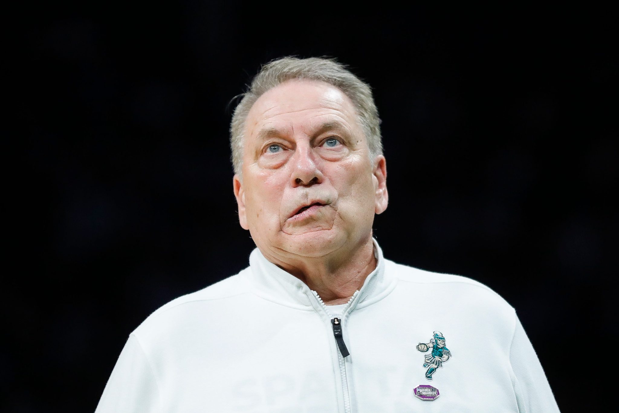 Tom Izzo is shown coaching.