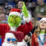 NFL fans dress in Christmas attire.