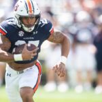 Jarquez Hunter runs the ball for the Auburn Tigers.