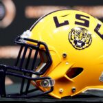 An LSU football helmet sitting on a table.