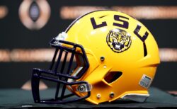 An LSU football helmet sitting on a table.