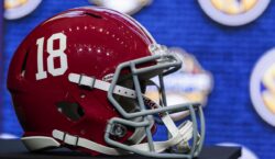 An Alabama football helmet sits on a table during SEC Media Days in 2022.