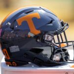 A Tennessee Volunteers football helmet sits on a Gatorade cooler during a game against LSU.