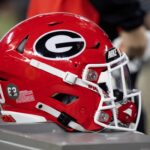 A Georgia Bulldogs helmet sits on a bench during the College Football Playoff championship game.