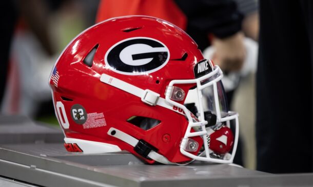 A Georgia Bulldogs helmet sits on a bench during the College Football Playoff championship game.