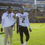 Deion Sanders and Shedeur Sanders are shown.
