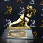 A closeup view of the Heisman Trophy.