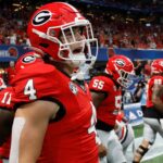 Oscar Delp takes the field before a game.