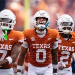 Texas players take the field for a game against UTSA.