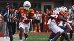 Isaiah Bond catches a pass in 2024.
