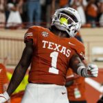 Johntay Cook celebrates a touchdown.