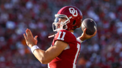 Oklahoma QB Jackson Arnold warms up on the sidelines.