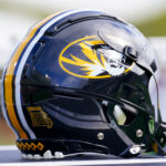 Mizzou helmet show on sideline.
