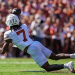 Texas WR Isaiah Bond dives for a catch.