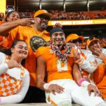 Tennessee QB Nico Iamaleava celebrates with his family after a win over Florida.