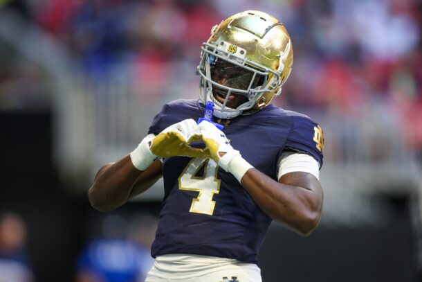 Jeremiyah Love celebrates after scoring a touchdown.