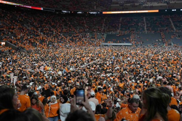 Tennessee fans rush the field after beating Alabama.