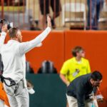 Steve Sarkisian urges Texas fans to stop throwing trash onto the field.