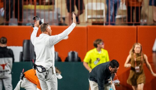 Steve Sarkisian urges Texas fans to stop throwing trash onto the field.