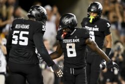 Le'Veon Moss celebrates a big play for Texas A&M.