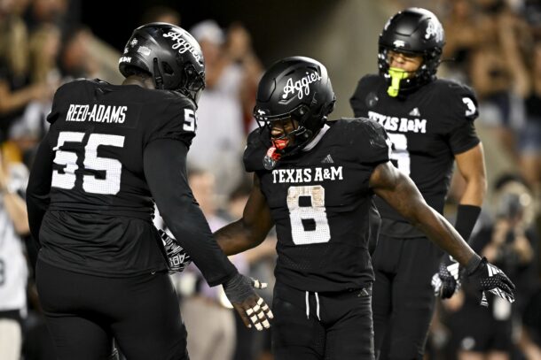 Le'Veon Moss celebrates a big play for Texas A&M.