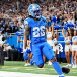 Jahmyr Gibbs scores a touchdown in 2024.