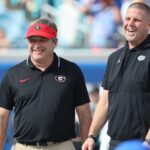 Kirby Smart and Billy Napier laugh before the Georgia-Florida game.